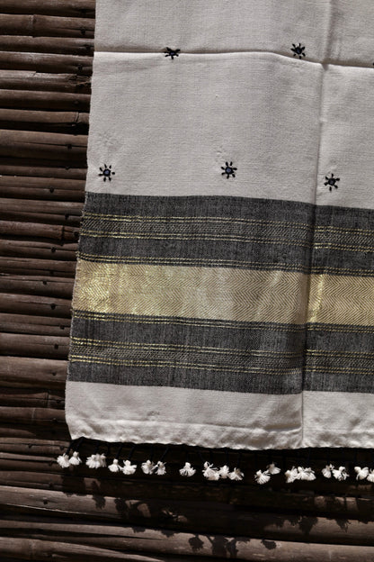 Elegant pearl white wool stole handcrafted using traditional handloom weaving techniques