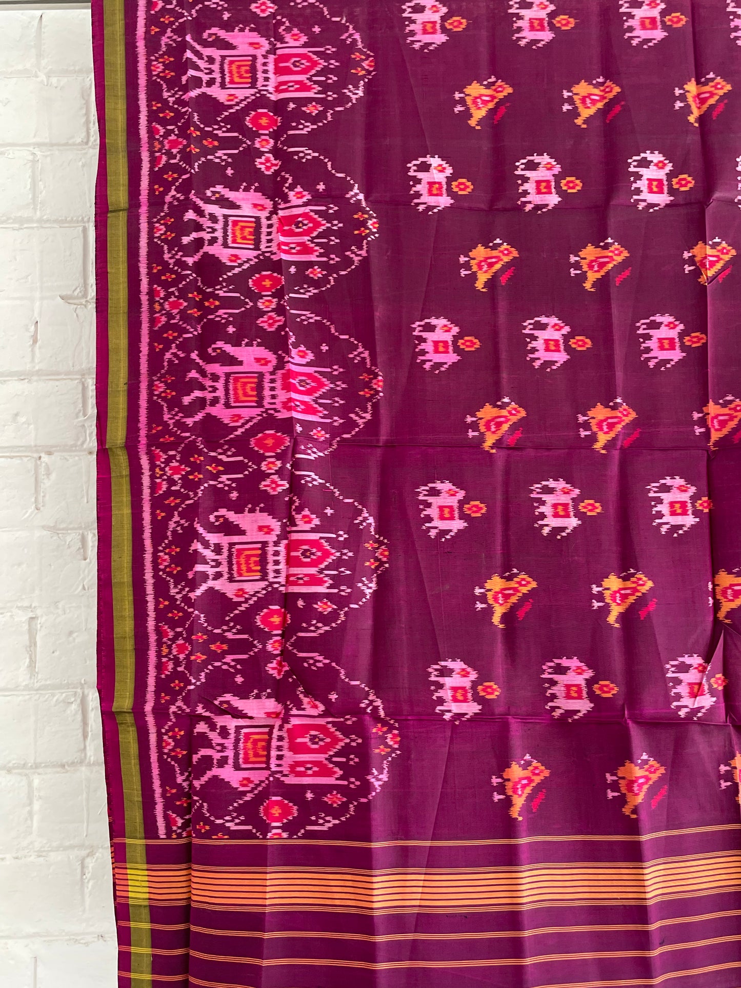 Magenta Patola Single Ikkat dupatta featuring intricate woven motifs and traditional artisan craftsmanship
