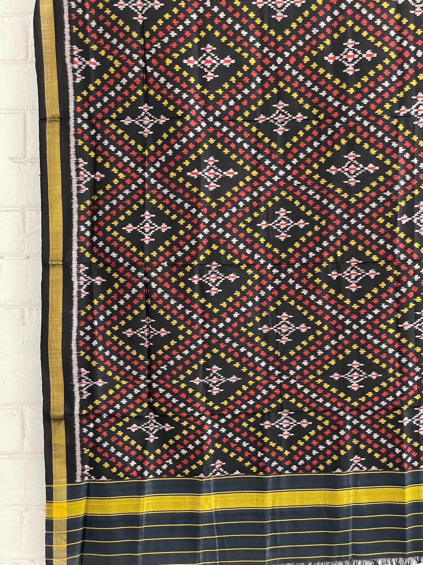 Midnight black Patola Single Ikkat dupatta featuring intricate woven motifs and traditional artisan craftsmanship