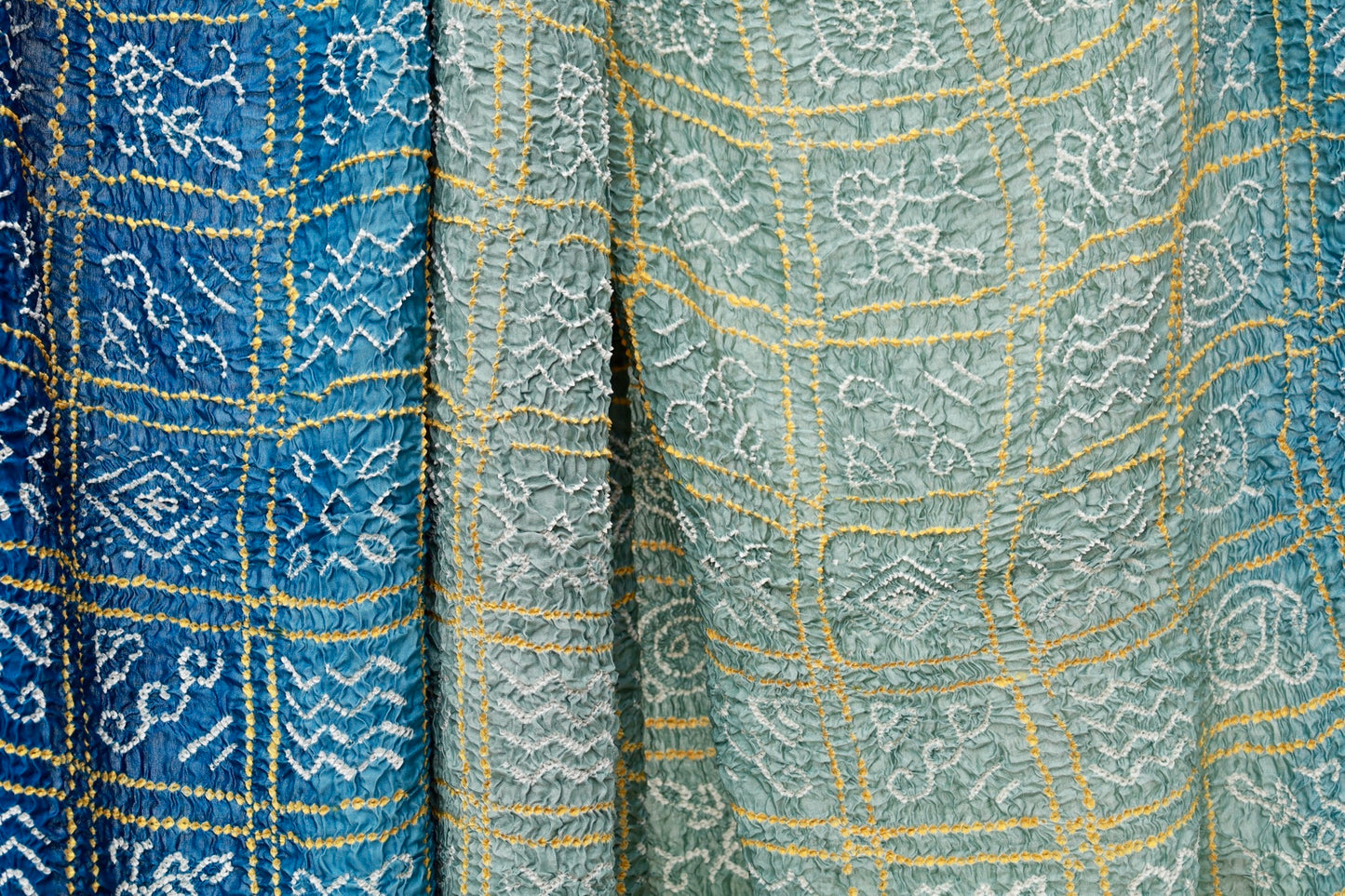 Midnight blue Rai Bandhani silk saree featuring intricate tie-dye patterns and an elegant zari pallu
