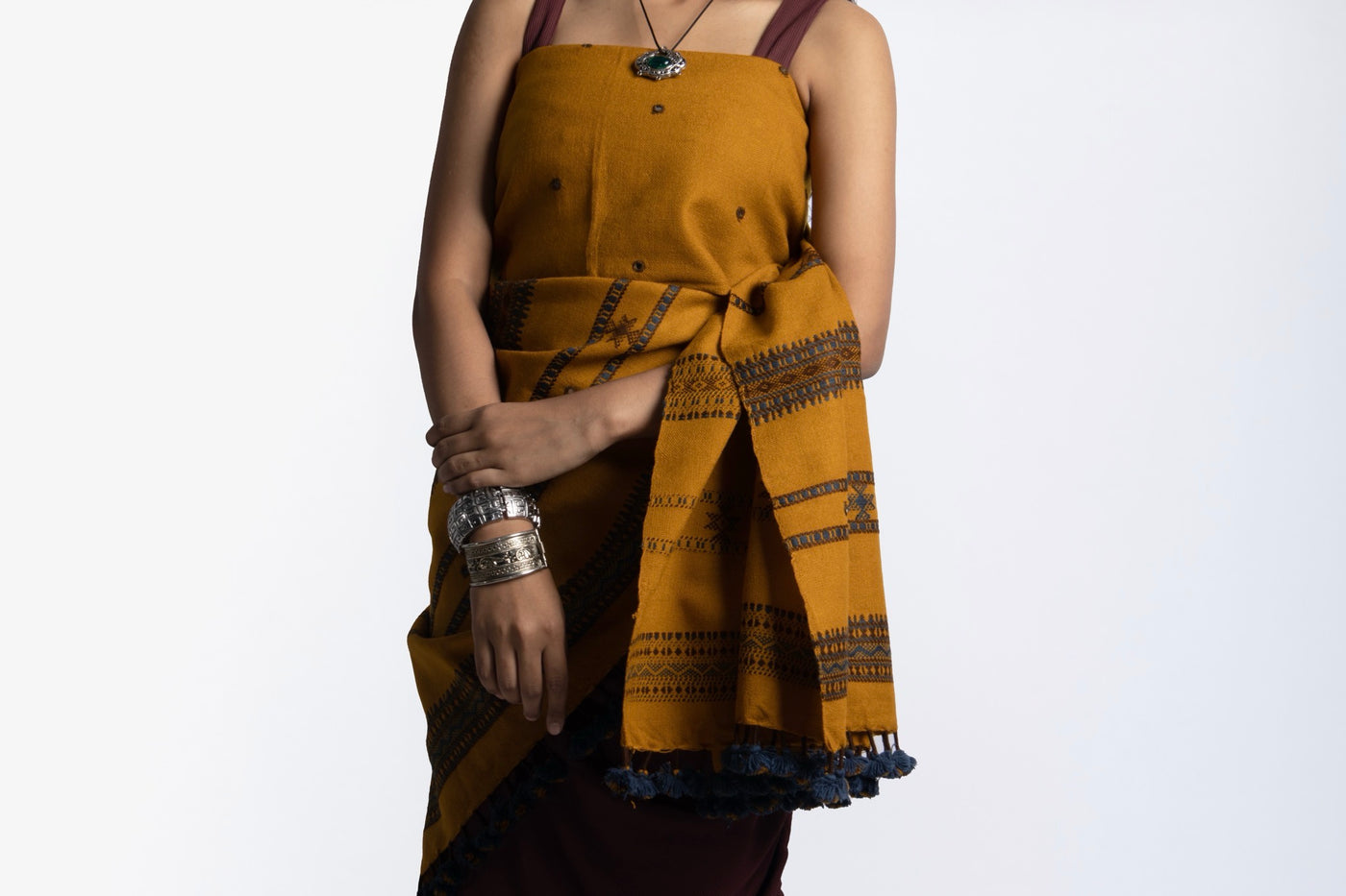 Elegant mustard wool shawl handcrafted using traditional handloom weaving techniques
