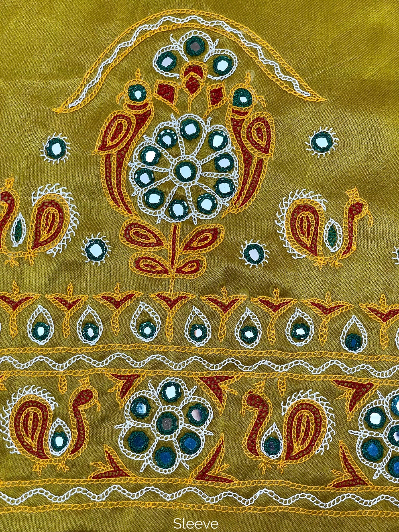 Mustard yellow Ahir embroidery blouse piece showcasing intricate handcrafted embroidery details