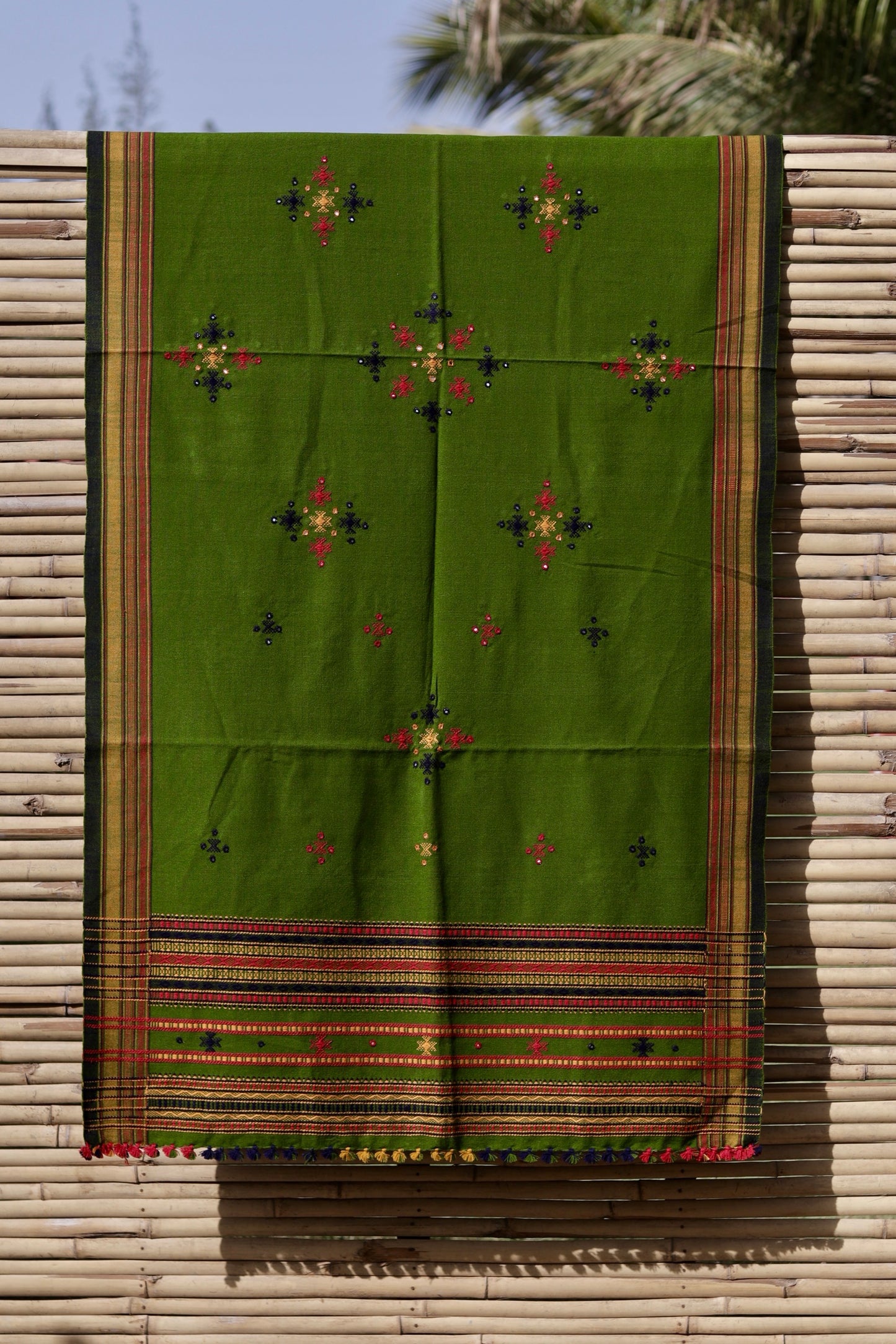 Elegant olive green wool shawl handcrafted using traditional handloom weaving techniques