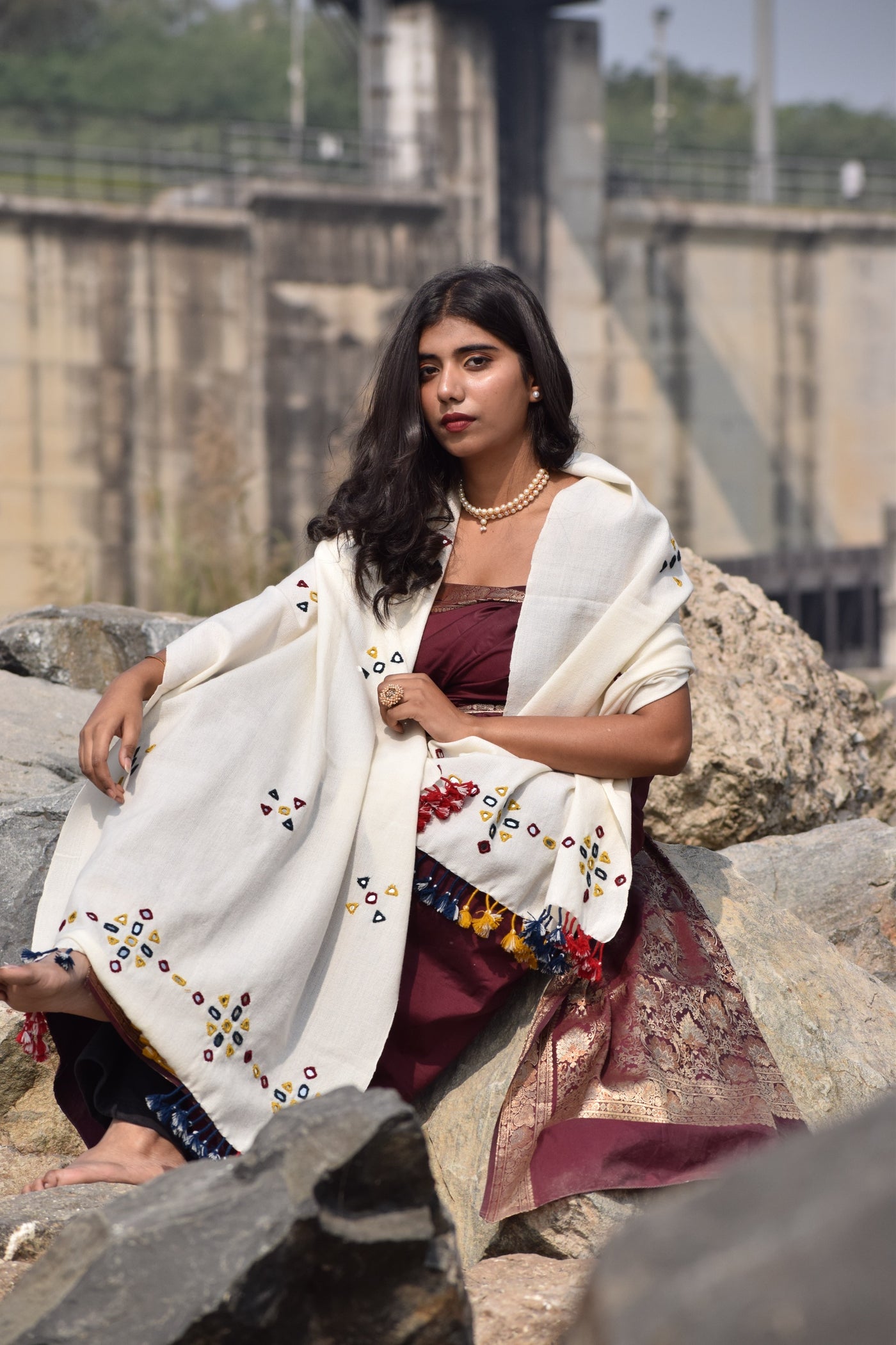 Elegant pearl white wool stole handcrafted by skilled artisans using traditional weaving techniques