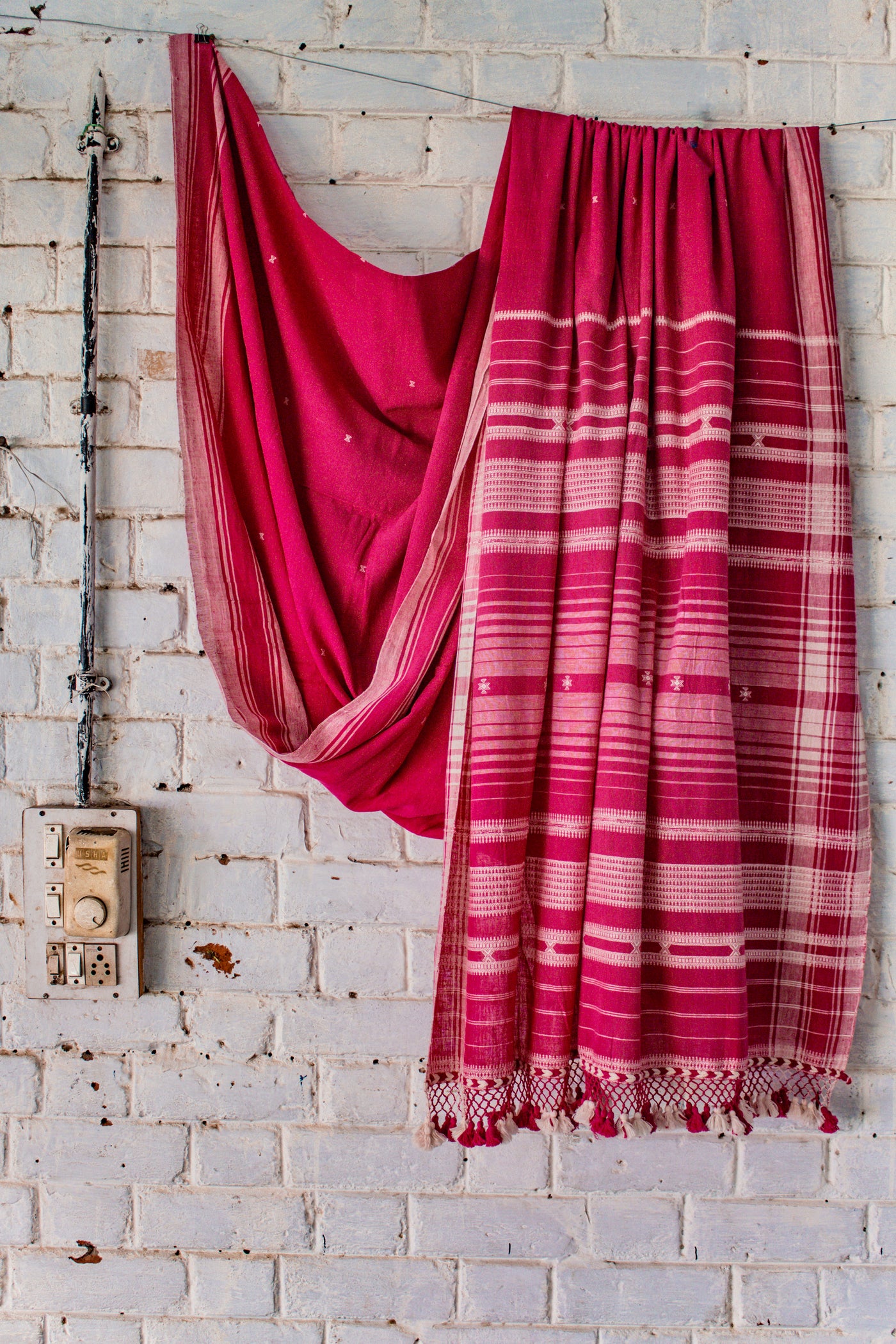 Rose Kala Cotton Bhujodi saree featuring traditional handwoven patterns and artisanal craftsmanship