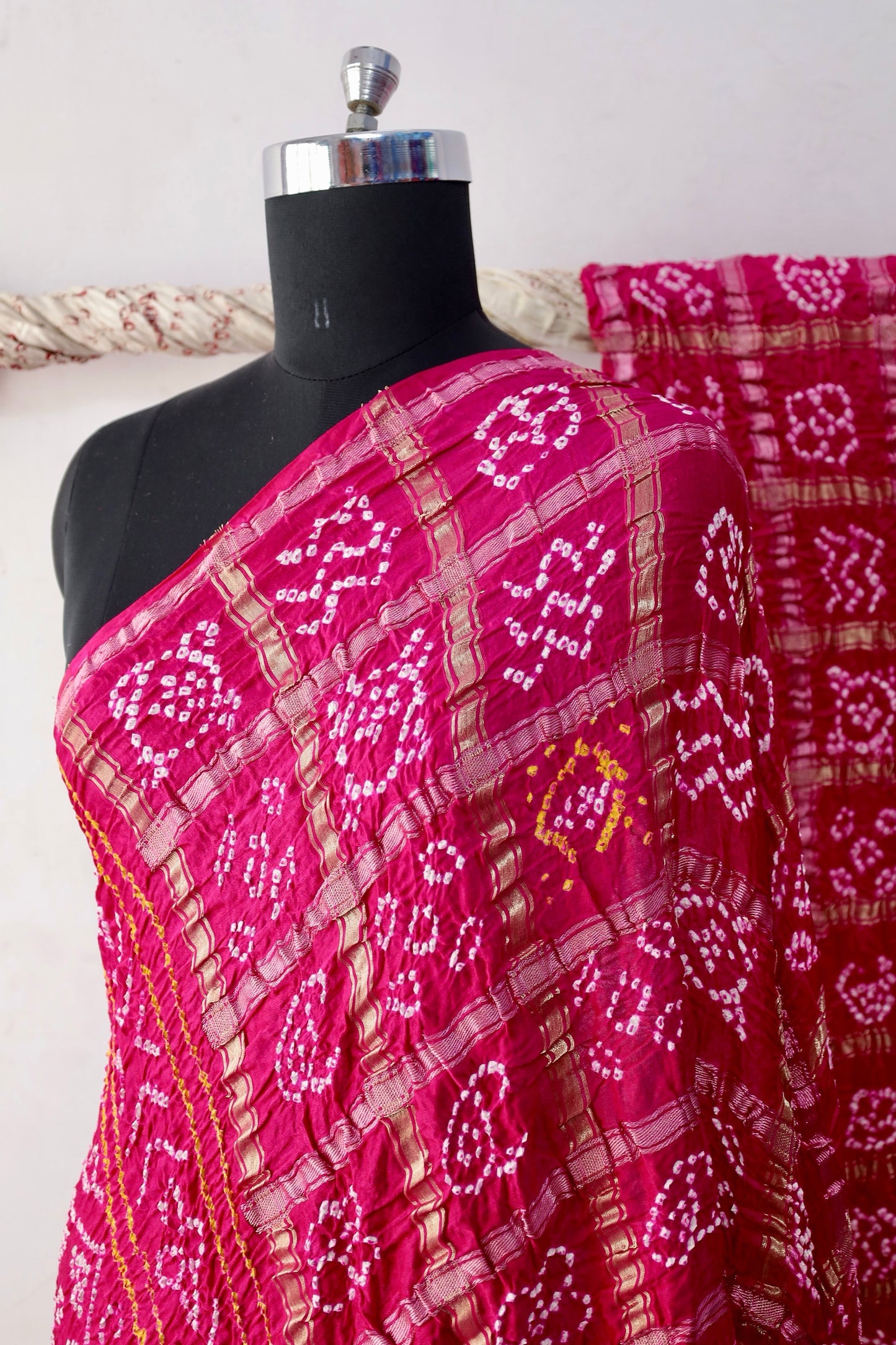 Rosewood Bandhani Gharchola Gajji silk saree featuring traditional tie-dye motifs and heritage-inspired checked patterns