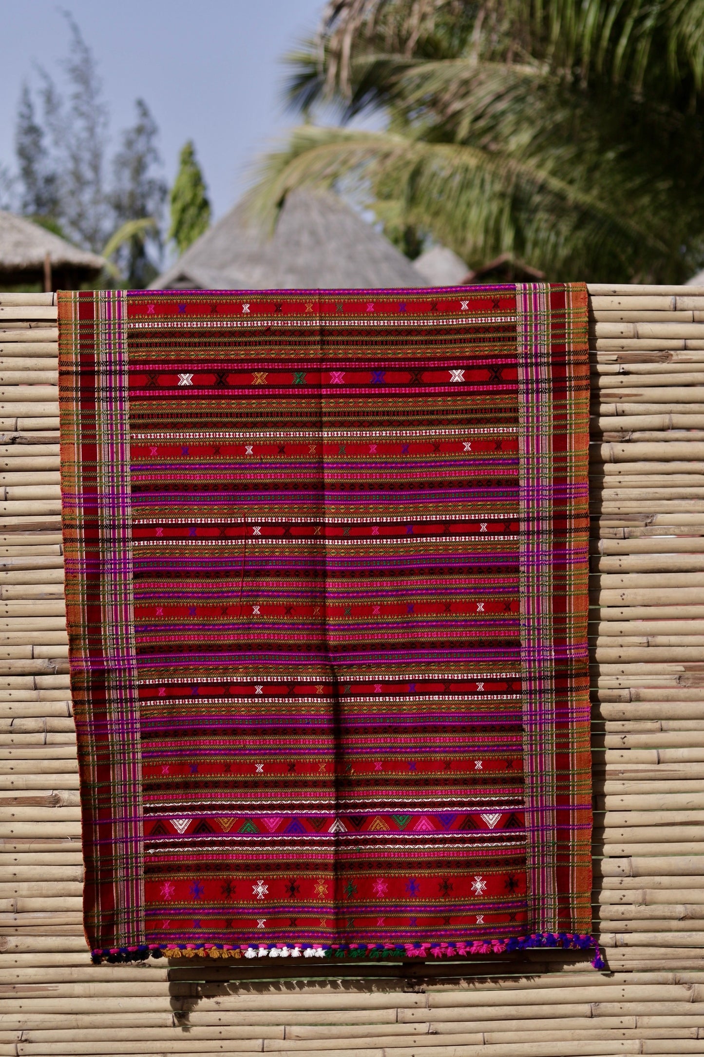 Elegant ruby red wool shawl handcrafted using traditional handloom weaving techniques