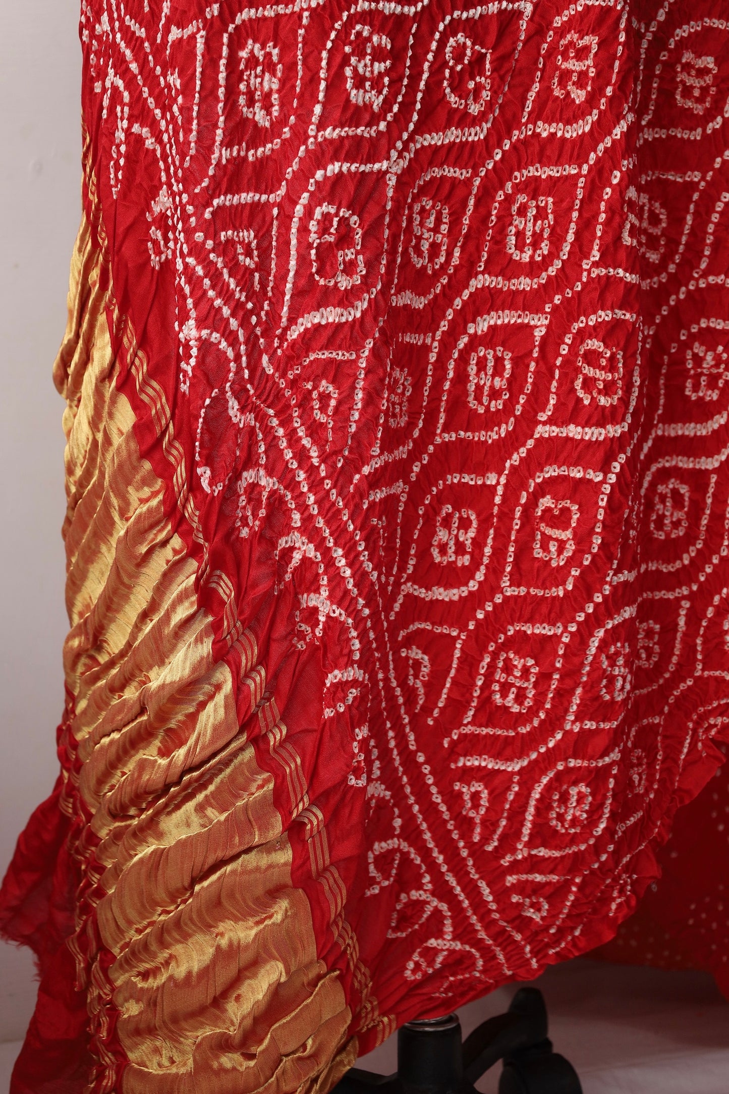 Handcrafted scarlet Gajji silk saree showcasing authentic Bandhani artistry with rich zari detailing