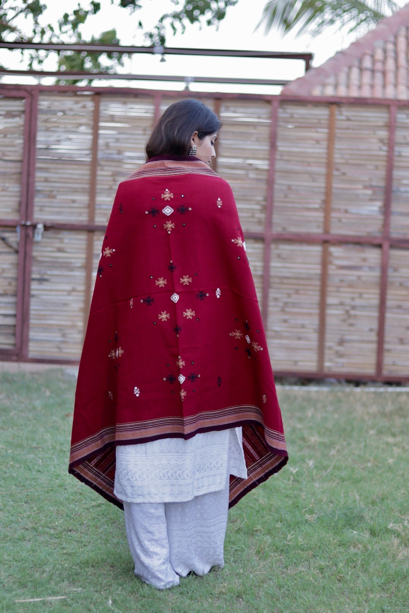 Elegant scarlet red wool shawl handcrafted using traditional handloom weaving techniques