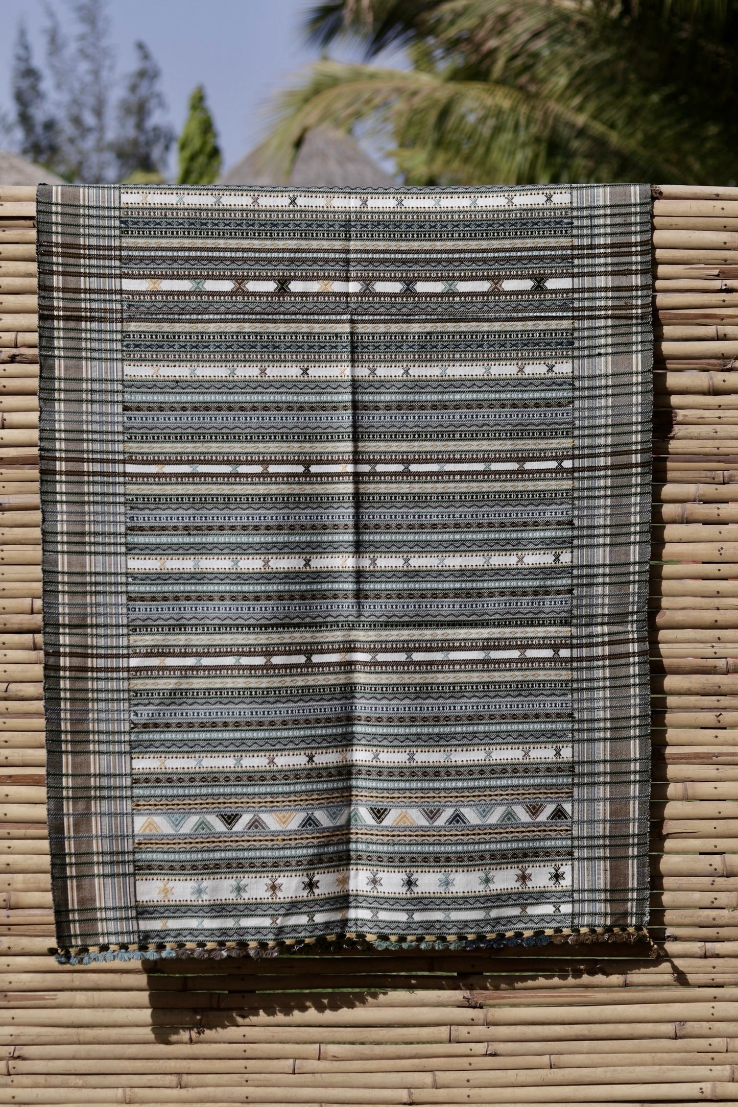 Elegant smoky white wool shawl handcrafted using traditional handloom weaving techniques