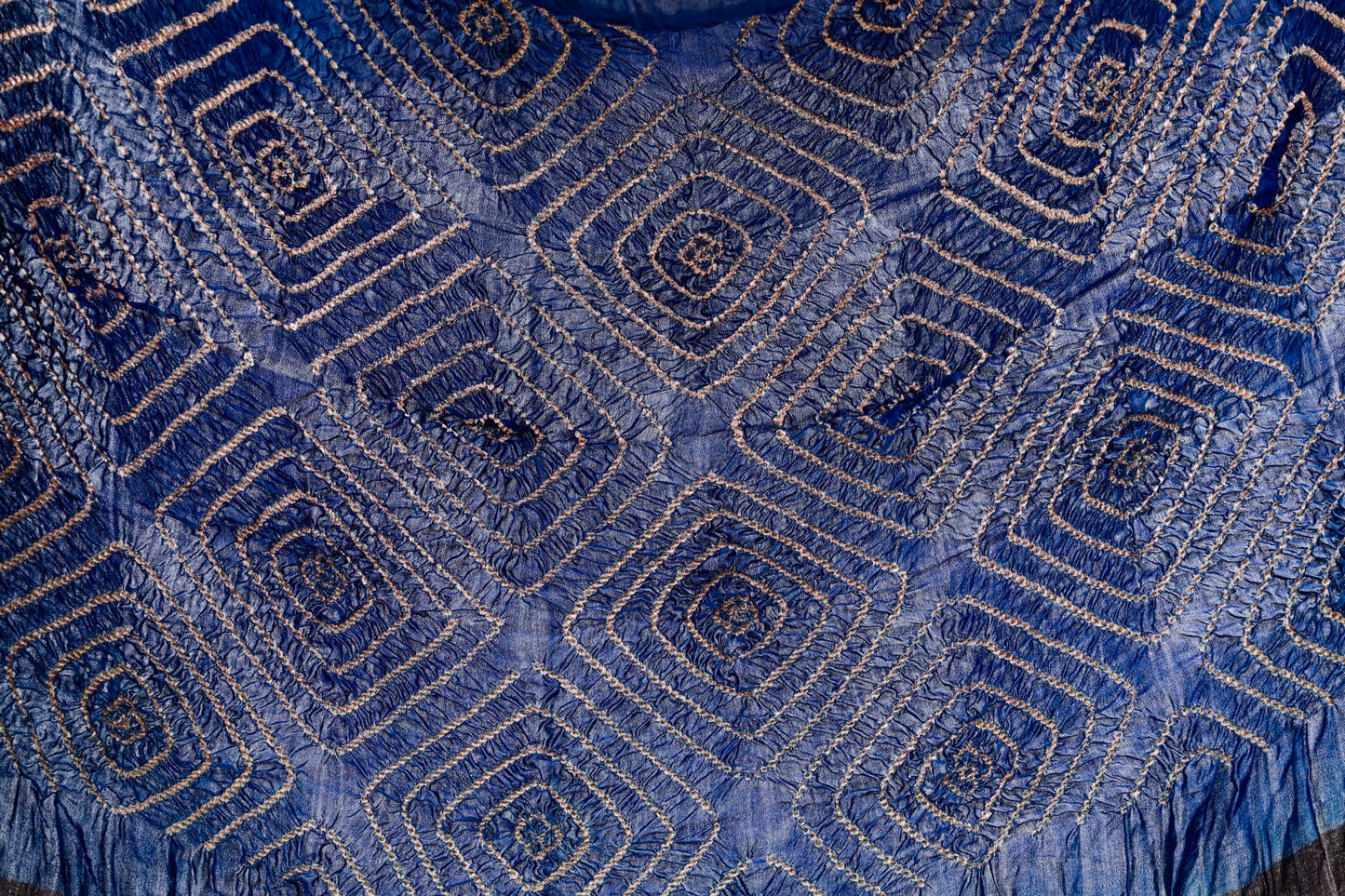 Teal Ajrakh Bandhani silk saree featuring intricate block-printed motifs and traditional tie-dye patterns