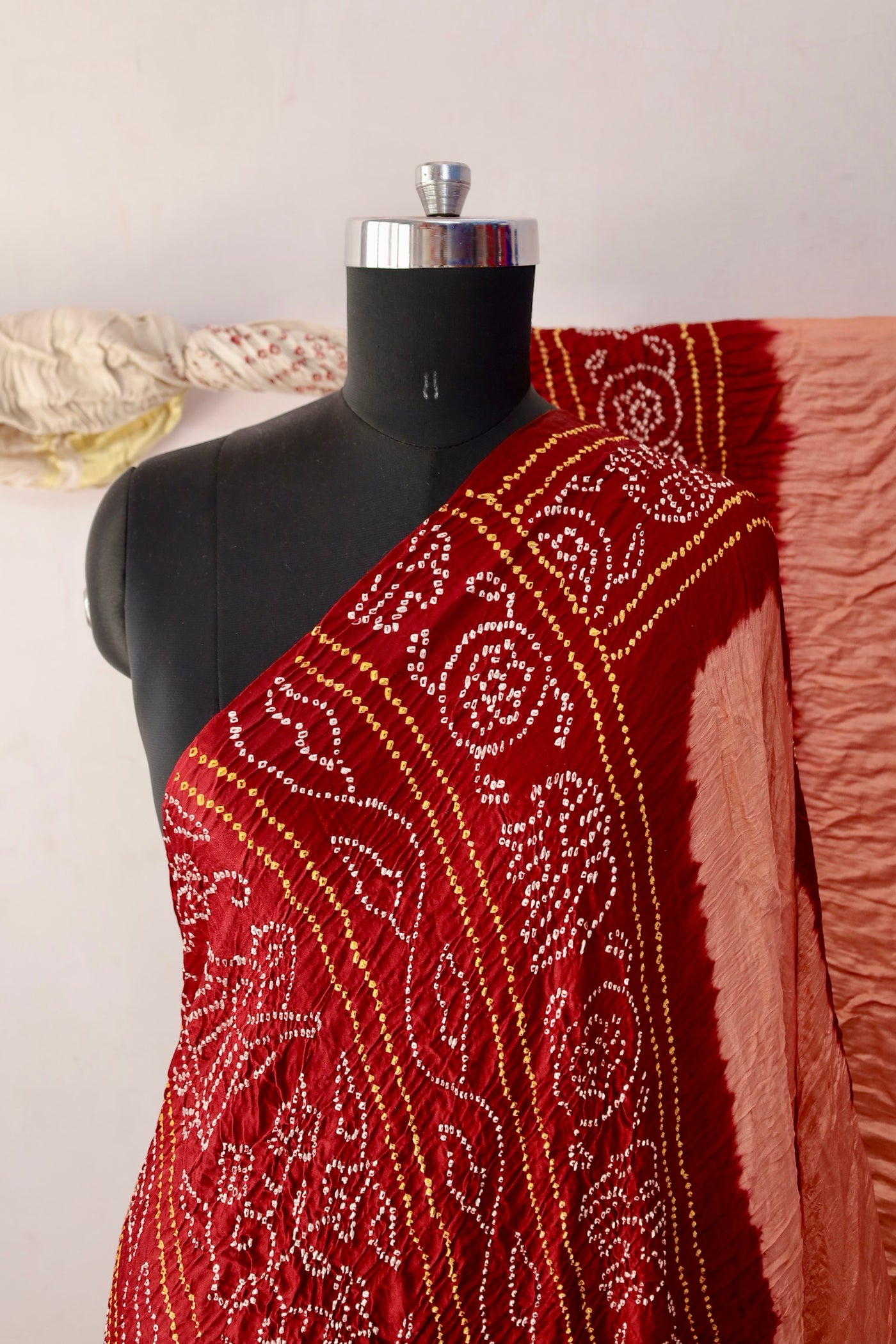 Terracotta Bandhani Gajji silk saree featuring intricate tie-dye patterns and an elegant zari pallu
