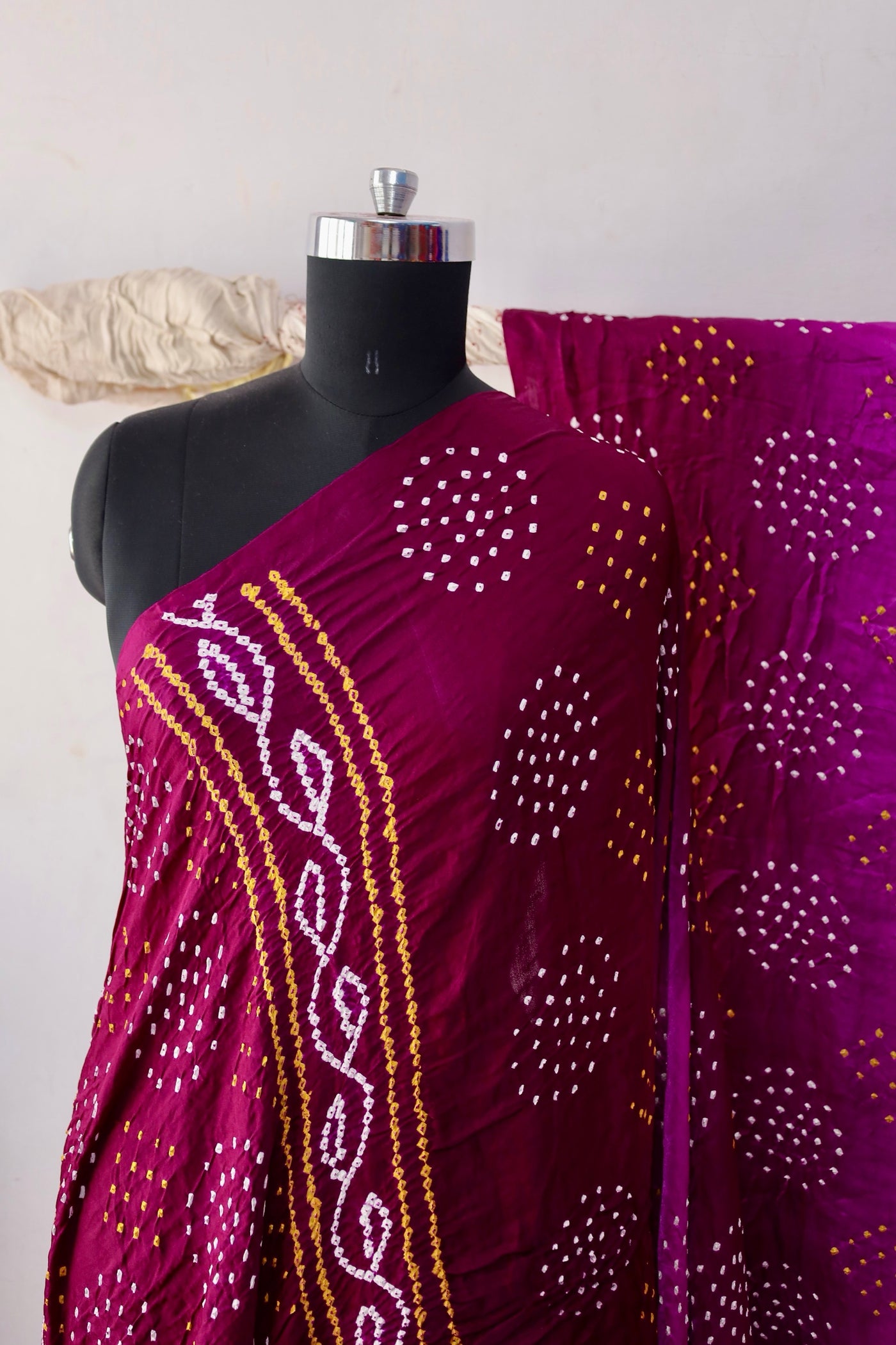 Wine Bandhani Gajji silk saree featuring intricate tie-dye patterns and an elegant zari pallu