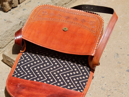 Artisan-crafted leather bag featuring traditional hand stitching and durable construction