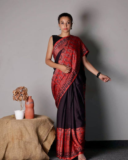 Black Ajrakh modal silk saree featuring intricate red motifs and traditional hand block printing