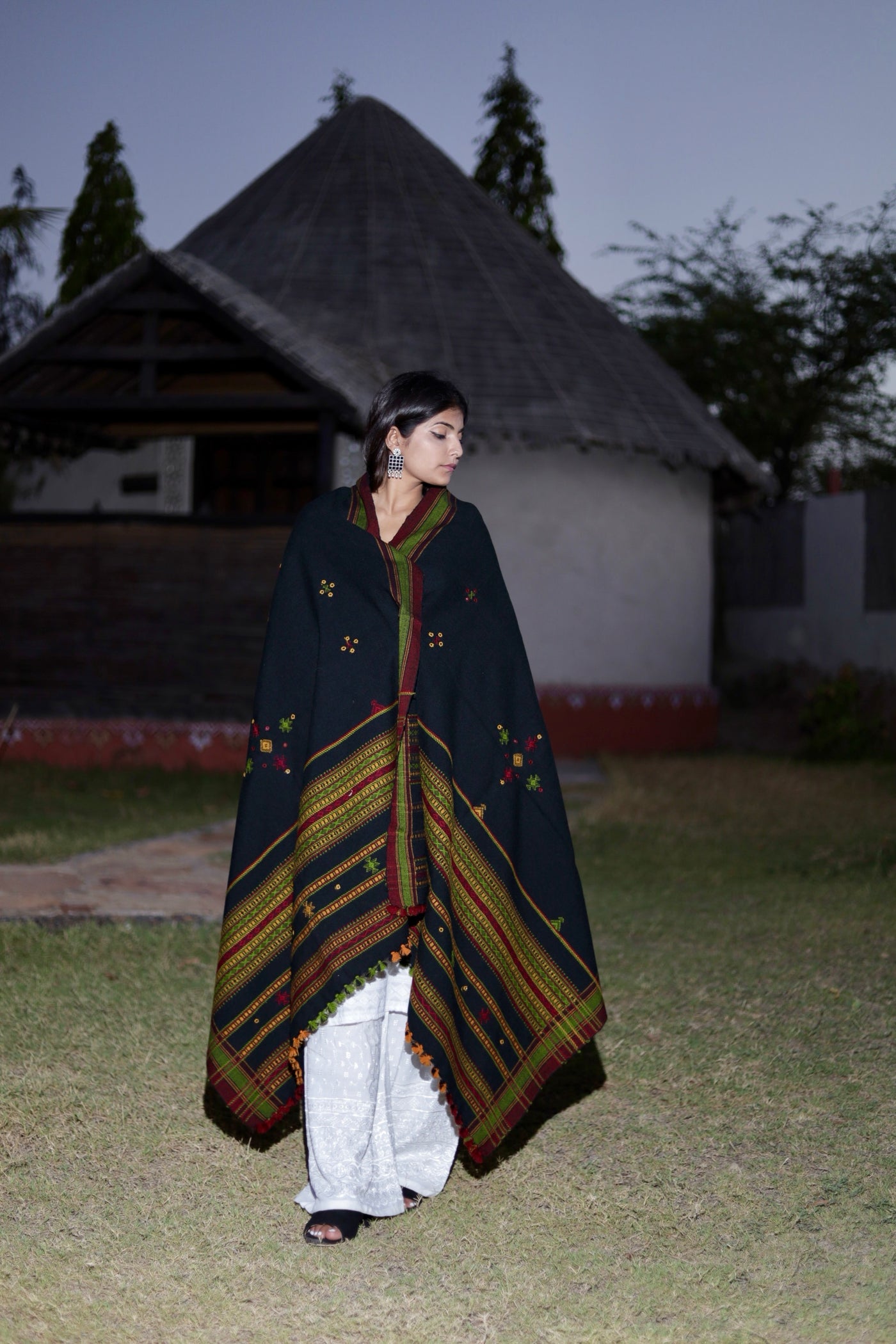 Black handwoven woolen shawl featuring a refined texture and authentic artisan craftsmanship