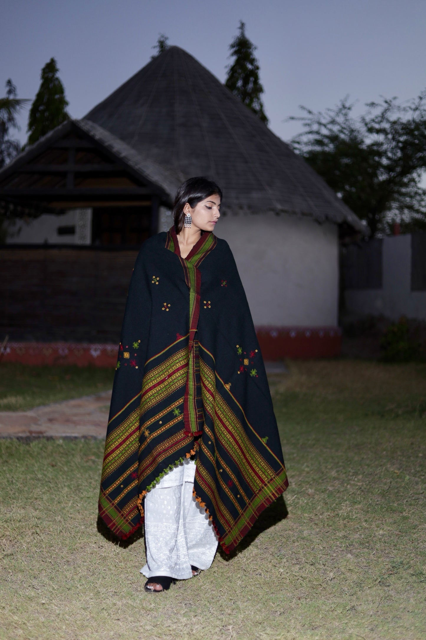 Black handwoven woolen shawl featuring a refined texture and authentic artisan craftsmanship