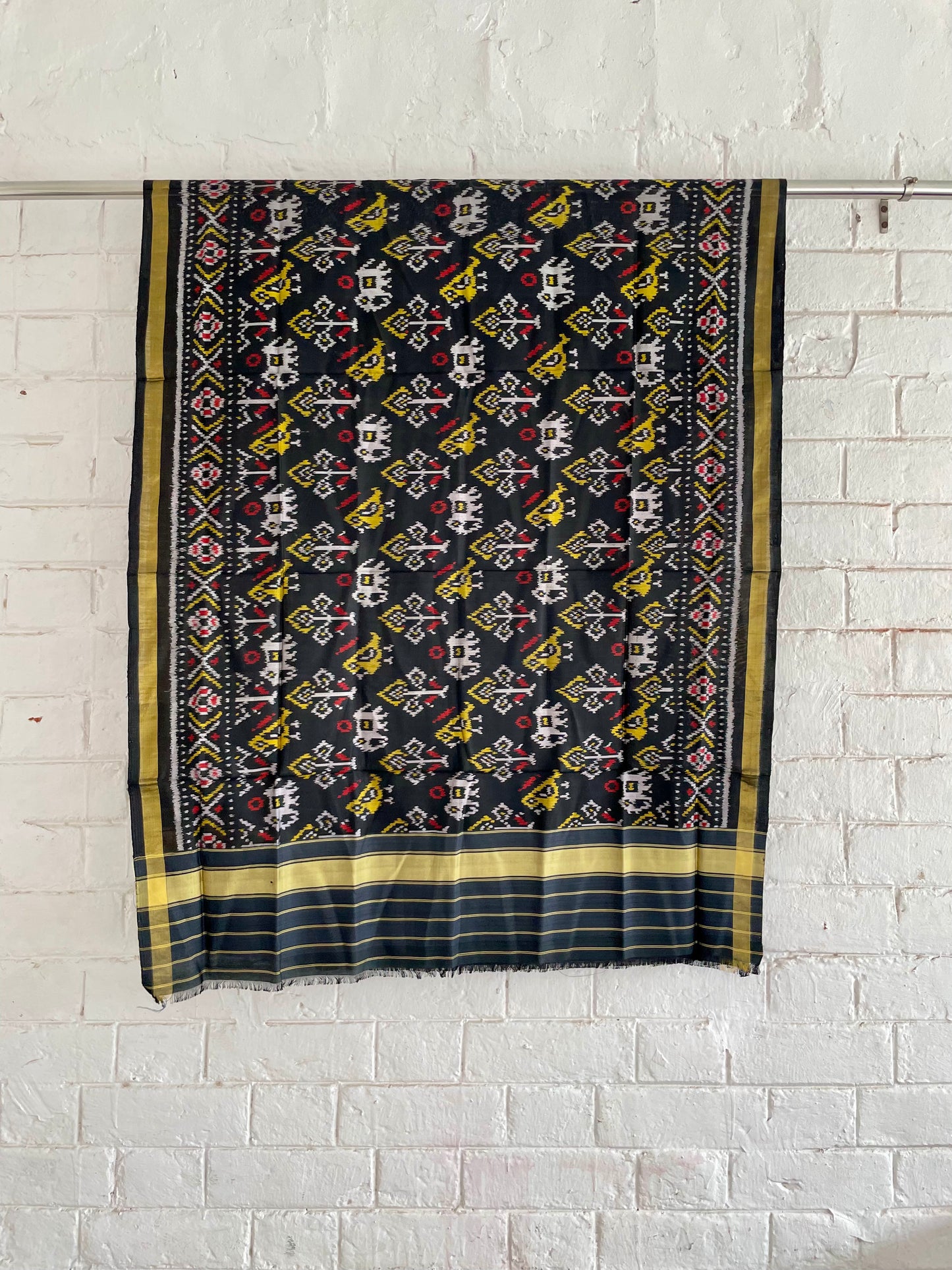 Black Patola Single Ikkat dupatta featuring intricate woven motifs and traditional artisan craftsmanship