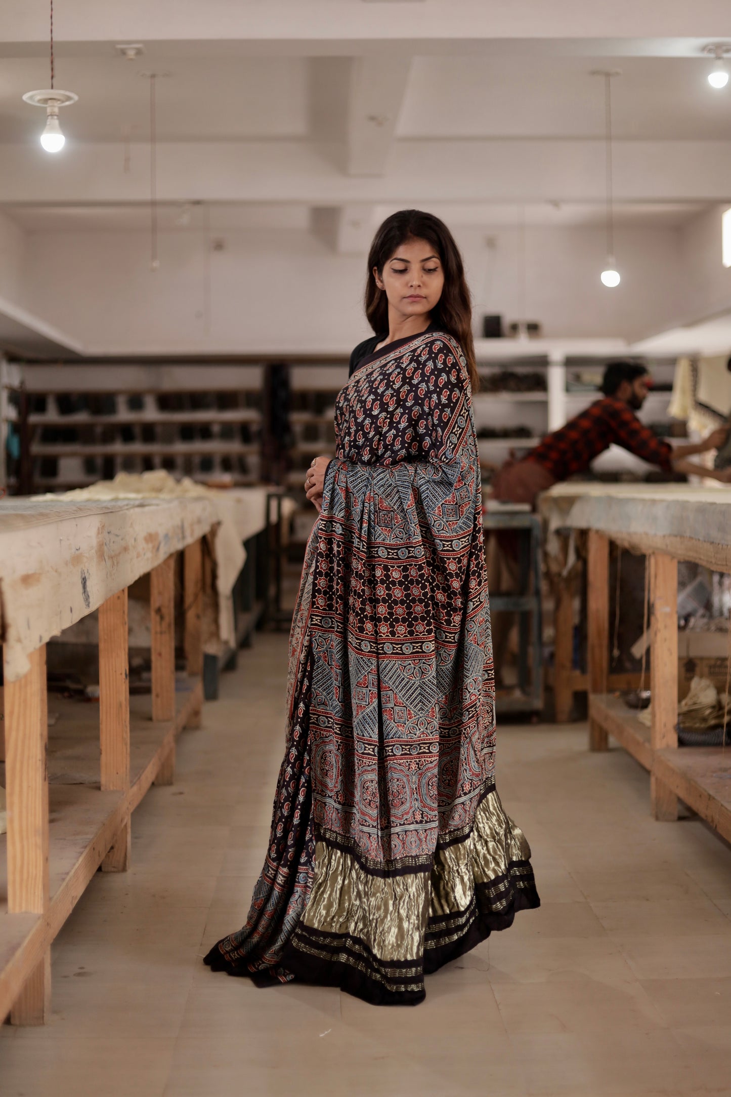 Black Ajrakh modal silk saree featuring intricate hand block printed motifs and a rich zari border