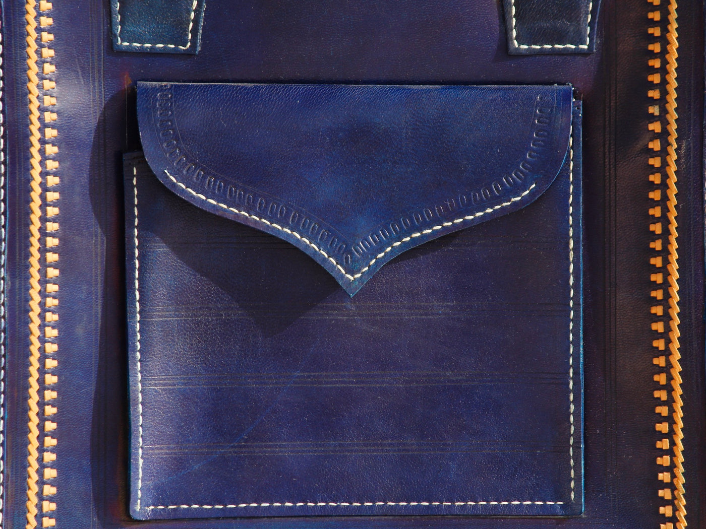Handstitched leather bag crafted from premium leather with meticulous handmade detailing