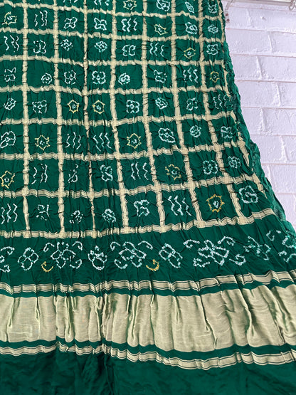 Handcrafted bottle green Gharchola dupatta featuring authentic Bandhani patterns and zari detailing