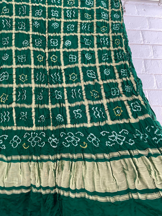 Handcrafted bottle green Gharchola dupatta featuring authentic Bandhani patterns and zari detailing