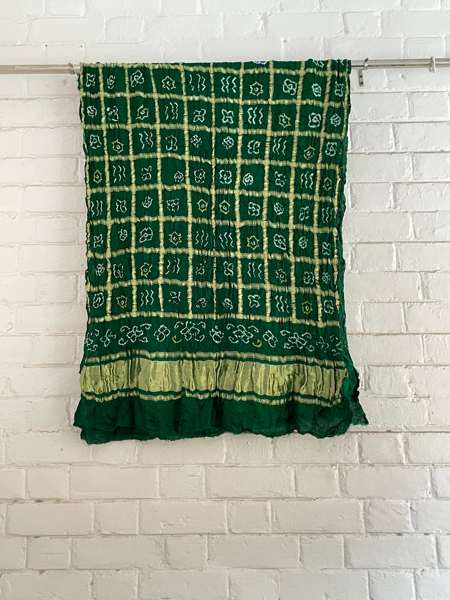 Ethnic bottle green Gharchola dupatta showcasing fine Bandhani artistry and woven zari accents