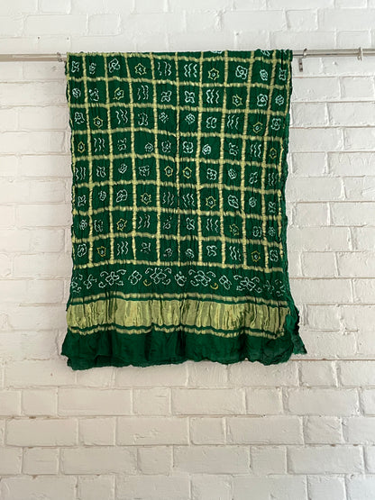 Ethnic bottle green Gharchola dupatta showcasing fine Bandhani artistry and woven zari accents