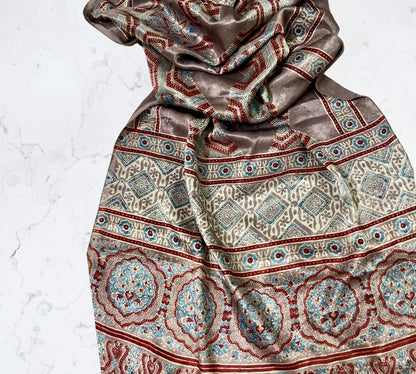 Bronze Ajrakh Mashru silk stole featuring intricate hand block printed motifs and elegant drape