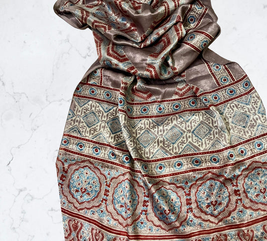 Bronze Ajrakh Mashru silk stole featuring intricate hand block printed motifs and elegant drape