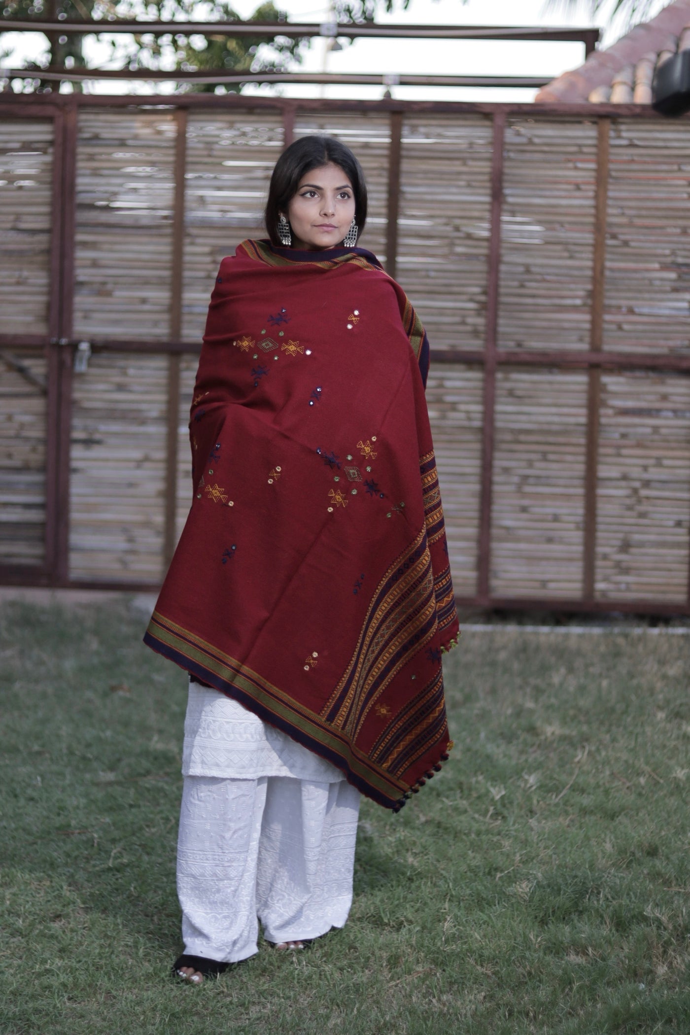 Burgundy handwoven woolen shawl featuring a rich texture and exquisite artisan craftsmanship