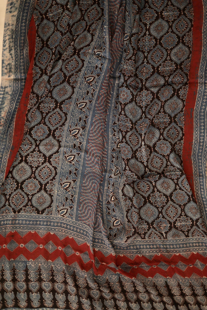 Charcoal grey Ajrakh modal silk dupatta featuring intricate hand block printed motifs and elegant drape