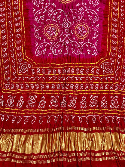 Cherry red and pink Bandhani Gajji silk dupatta featuring traditional tie-dye craftsmanship and elegant drape