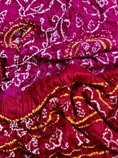 Luxurious cherry red and pink Bandhani dupatta crafted in soft and lustrous Gajji silk