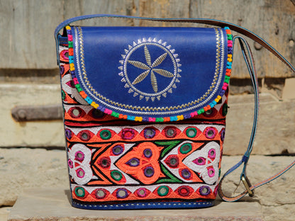 Handcrafted leather bag adorned with traditional Kutchi embroidered motifs and metallic zari detailing