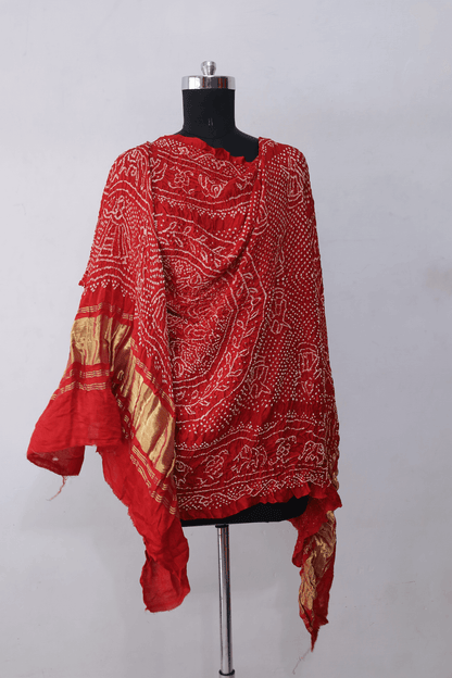 Coral red Gajji silk Rai Bandhej dupatta featuring intricate tie-dye craftsmanship and elegant drape