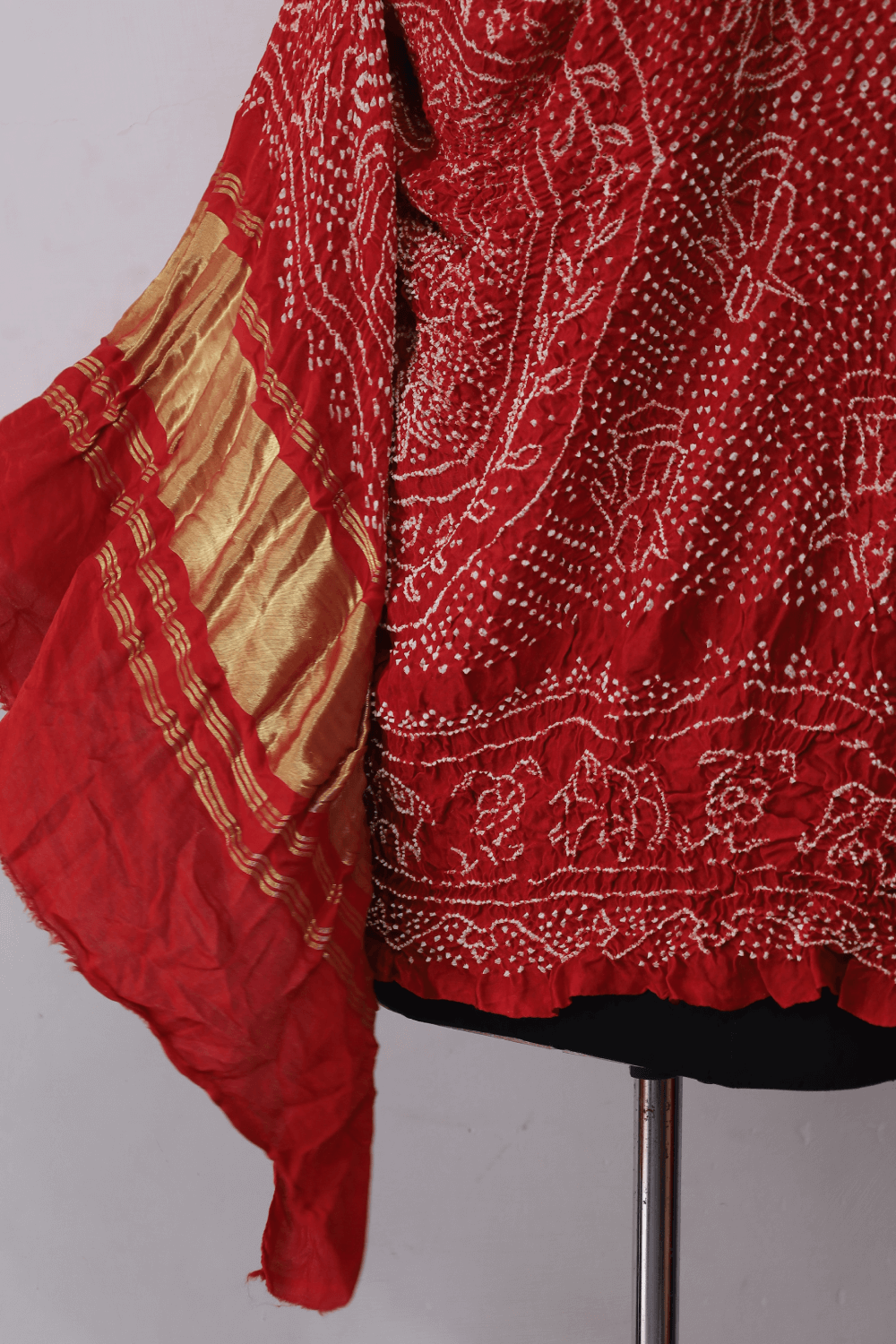 Traditional coral red Gajji silk dupatta showcasing authentic Rai Bandhej artistry