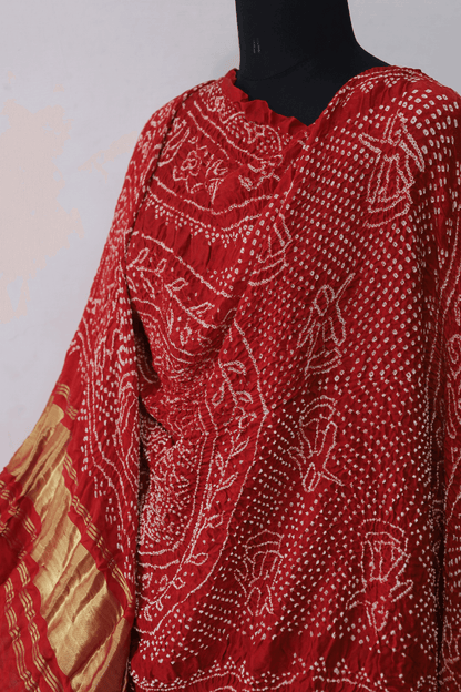 Handcrafted coral red Rai Bandhej dupatta made from premium Gajji silk fabric