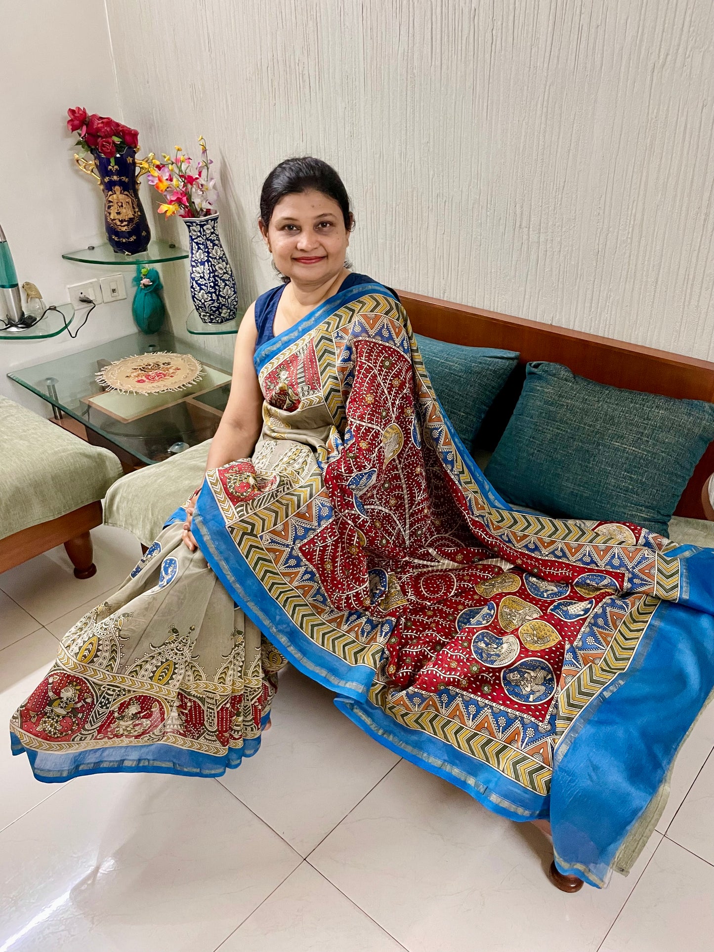 Creamy red handpainted Mata Ni Pachedi saree featuring traditional sacred motifs and intricate artisan detailing