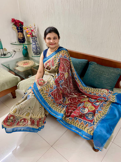 Creamy red handpainted Mata Ni Pachedi saree featuring traditional sacred motifs and intricate artisan detailing