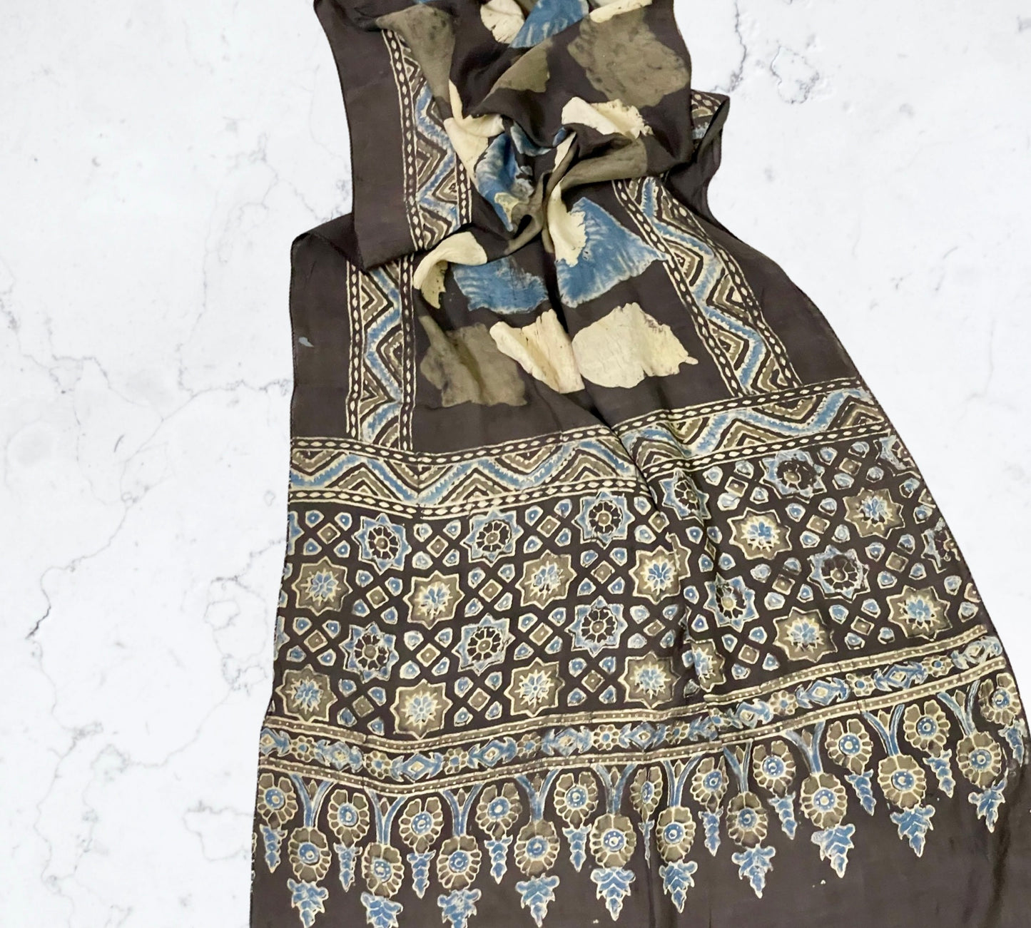 Dark olive green Ajrakh modal silk stole featuring intricate hand block printed motifs and elegant drape