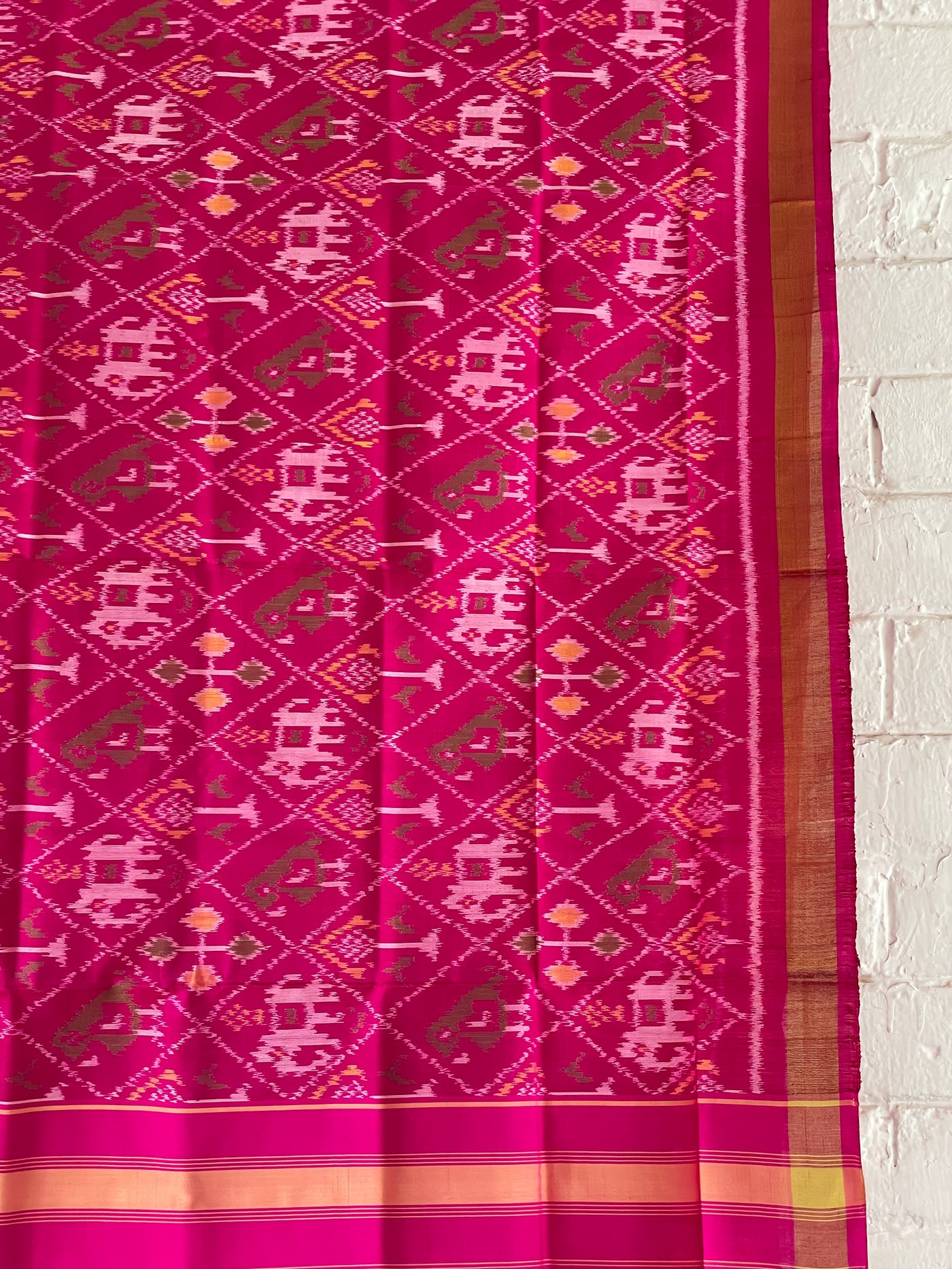 Dark pink Patola Single Ikkat dupatta featuring intricate woven motifs and traditional artisan craftsmanship