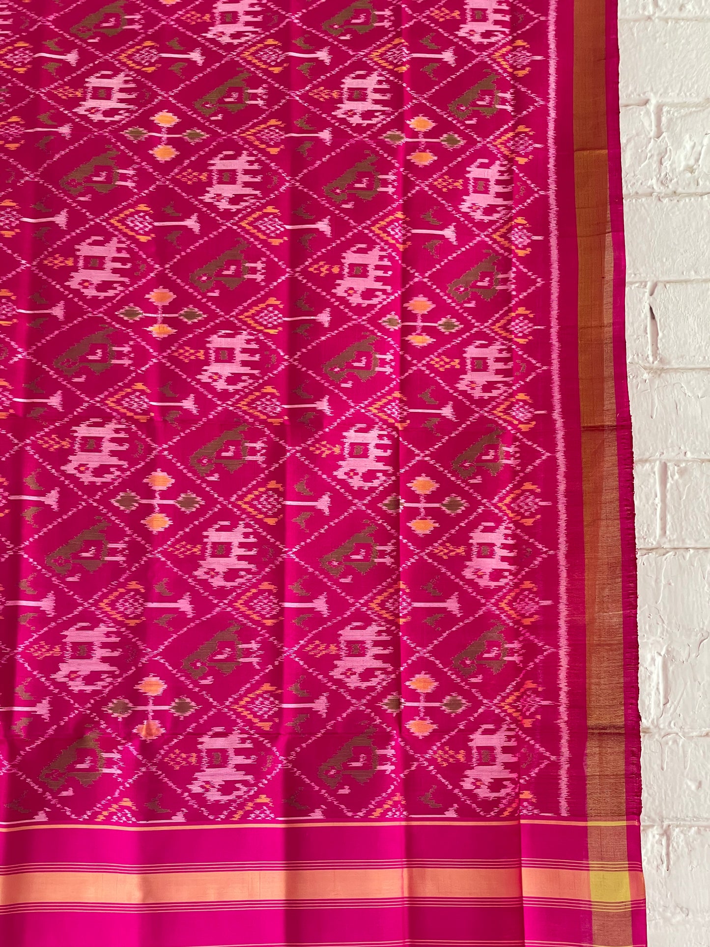 Dark pink Patola Single Ikkat dupatta featuring intricate woven motifs and traditional artisan craftsmanship