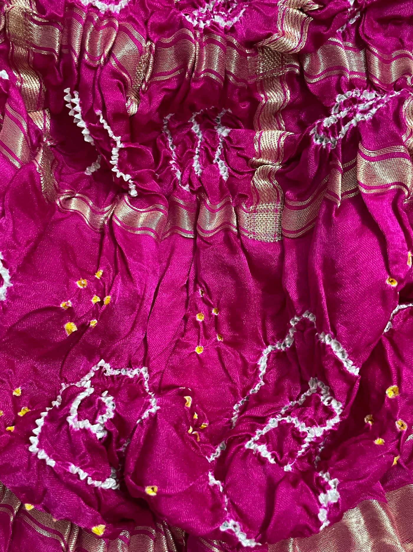 Traditional dark rose pink Bandhani Gharchola dupatta adorned with elegant zari work