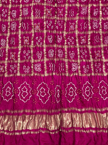Handcrafted dark rose pink Gharchola dupatta featuring authentic Bandhani patterns and zari detailing