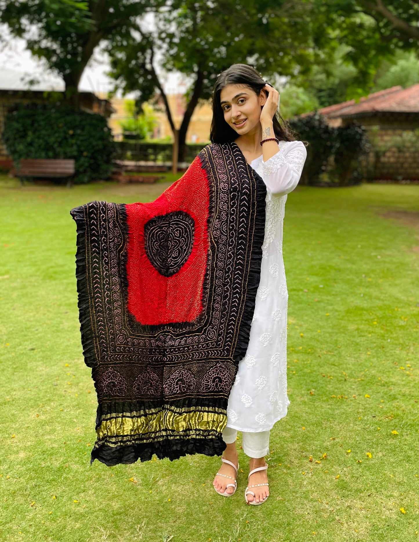 Deep red and black Bandhani Gajji silk dupatta featuring traditional tie-dye craftsmanship and elegant drape