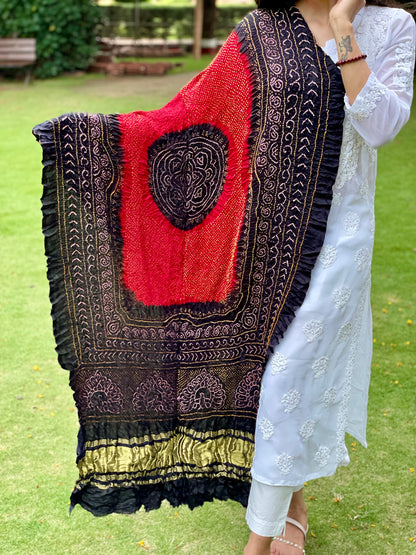 Traditional deep red and black Bandhani Gajji silk dupatta with intricate artisanal patterns