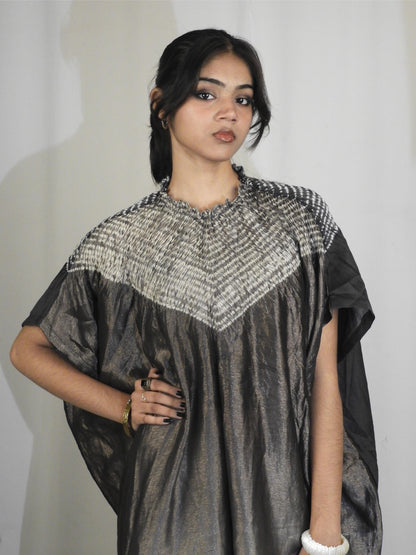 Deep black Bandhani Shibori silk kaftan showcasing intricate handcrafted resist-dye patterns and elegant drape