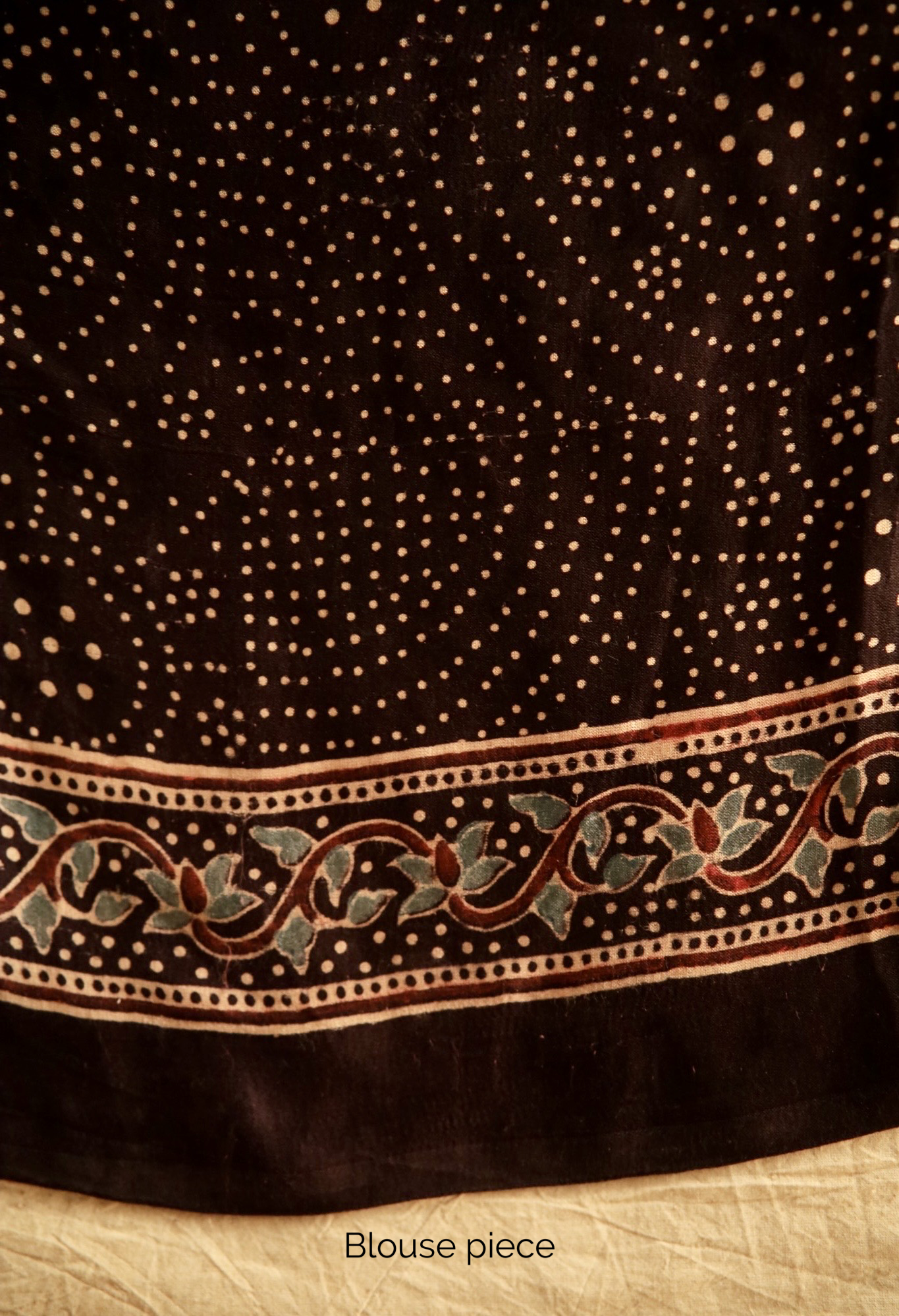 Premium deep black modal silk saree showcasing authentic Ajrakh craftsmanship and heritage-inspired motifs. Traditional deep black Ajrakh modal silk saree with rich artisanal prints and a soft flowing texture