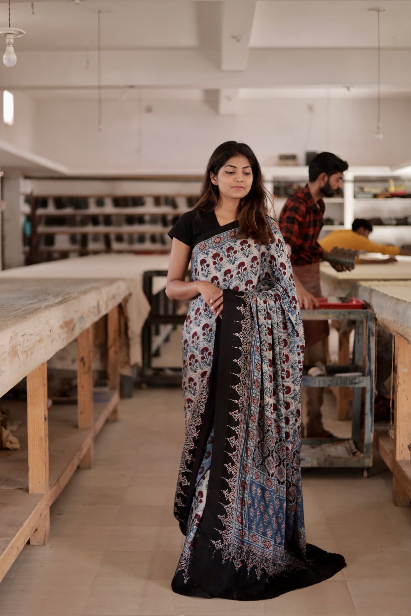 Dove grey Ajrakh modal silk saree featuring intricate hand block printed motifs and a graceful drape